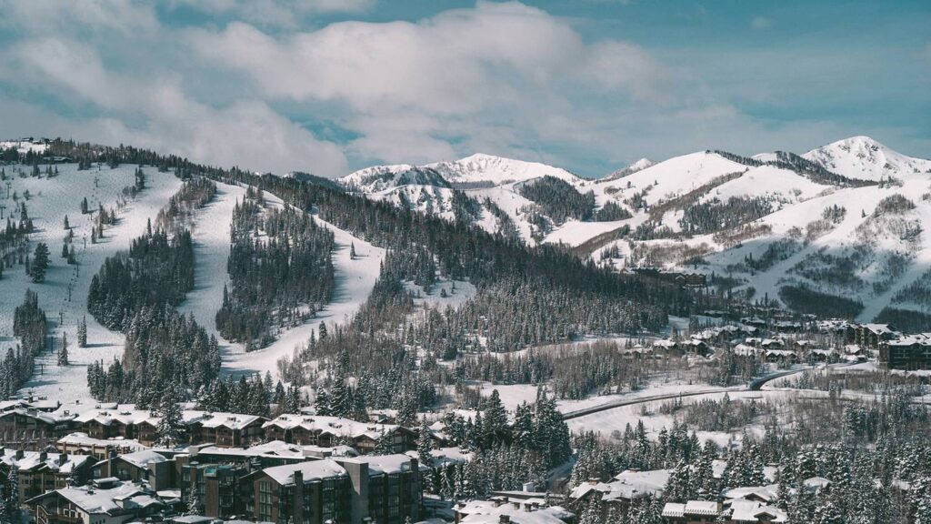 A panoramic view of Deer Valley Resort, offering world-class skiing in winter and mountain biking, hiking, and scenic chairlift rides in summer.